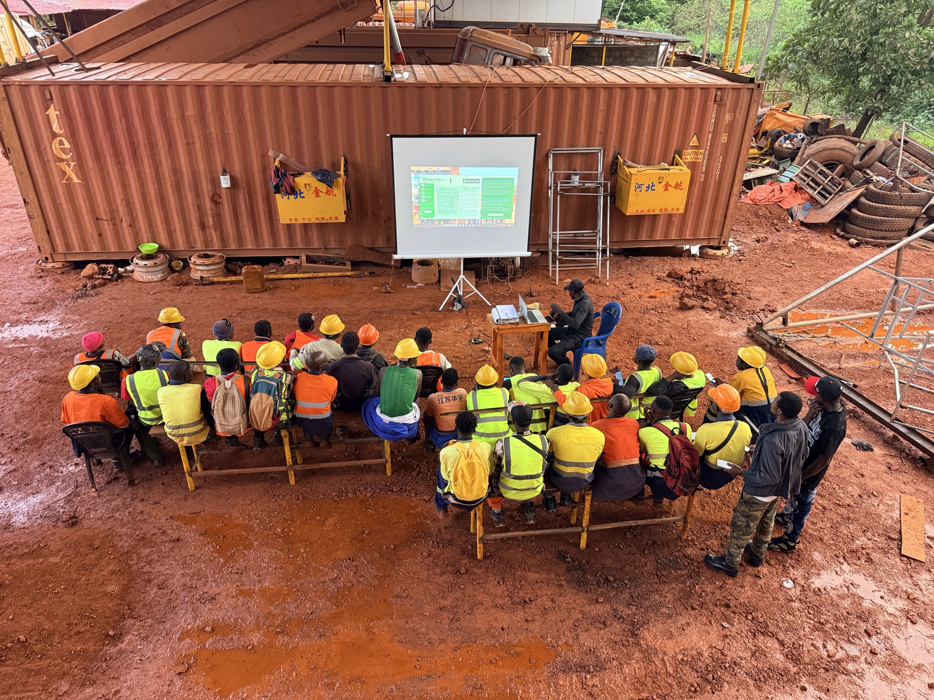 Evening safety training session under work-yard lights